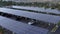 Solar panels on roof of car park, Santa Clarita, California, rising aerial