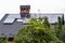 Solar panels on the roof of a country house, alternative energy sources for humans