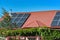 Solar panels on the roof of a country house, environmental production of solar energy in electrical