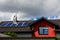 Solar panels on the roof of a house in cloudy weather. The concept of poor location, bad weather, and payback