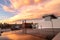 Solar panels on top of a residential roof with a soft colorful sunset in the sky. Denver Colorado.