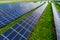 Solar panes  on green grass in a solar park