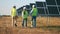 Solar power station and a group of engineer walking along it