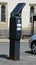 A solar-powered parking meter, with photo-electric cell