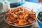 Solated prepared orange shrimp on background table on kitchen, closeup of fresh prawn products in restaurant