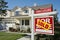 Sold Foreclosure Home For Sale Sign and House