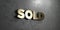 Sold - Gold sign mounted on glossy marble wall - 3D rendered royalty free stock illustration