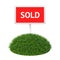 Sold sign with grass