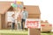 sold signboard with young family on yard of their new cardbord house blurred on background