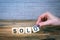 Sold. Wooden letters on the office desk