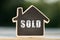 Sold written on the little house shape tag - real estate concept