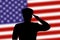 Solder silhouette on blur background with United States flag