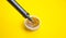 Soldering iron, tin, rosin on a yellow background. Macro. Repair of electrical equipment, radio engineering. Solder wires,