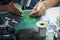 The  soldering operator repair the electronics circuit board.