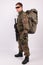 Soldier with backpack and gun on white background