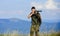 Soldier in the field. polygon. muscular man hold weapon. purpose and success. army forces. sniper reach target mountain