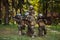 Soldier fighters standing together with guns. Group portrait of US army elite members, private military company