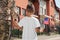 Soldier and his little son with American flag, back view. Veterans Day in USA