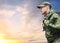 Soldier in military uniform with backpack hiking