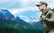 Soldier in military uniform with backpack hiking