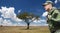 Soldier in military uniform with backpack hiking