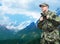 Soldier in military uniform with backpack hiking