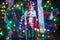 Soldier nutcracker statue standing in front of decorated Christmas tree