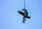 Soldier rescue emergency by army helicopter with rope on blue sky