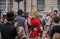 Soldier of Royal Horse Guards in London surrounded by tourists including Hasidic Jewish family in foreground