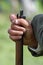 A soldier\'s hand with dirty fingernails while holding the barrel