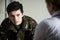 Soldier Suffering With Stress Talking To Counselor