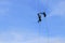Soldier two rappelling with rope on blue sky