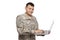 Soldier typing lon laptop