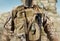 Soldier in uniform standing in desert closeup view