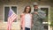 Soldier and wife showing keys from new house, government social insurance