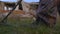 The soldier works with a mine detector in the ruins of houses in search of mines and explosives