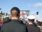 Soldiers from Canadian Army, two men, from Navy & ground forces, seen from behing, standing on ceremony for Remembrance day