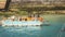 Soldiers monitor and protect the tourists on board a boat