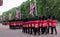 Soldiers with rifles marching down The Mall in London. Photo taken during the Trooping the Colour military ceremony, London