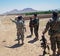 Soldiers searching for directions in a village in Afghanistan