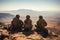 Soldiers seated atop desert cliff, embodying strength and camaraderie