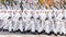 Soldiers skiers in white winter camouflage suits parade across the square