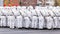 Soldiers skiers in white winter camouflage suits parade across the square