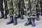 Soldiers stand in camouflage military uniform