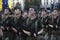 Soldiers of a womens battalion marching with machine guns. Military parade