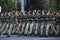 Soldiers of a womens battalion marching with machine guns. Military parade