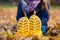 Sole of yellow gumboots at leaves close up