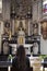 Solemn Prayer at an Ornate Church Altar