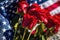 A Solemn Tribute: Red, White, and Blue Flowers at an Outdoor Memorial