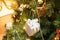 Solf focus of christmas tree decoration. Silver gift box hanging on the branches of a Christmas tree,
